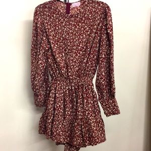 Women’s size small Pink Lily floral romper. Like new